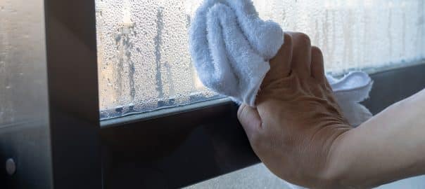 Wiping away Condensation. How to stop condensation on windows, doors and conservatories.